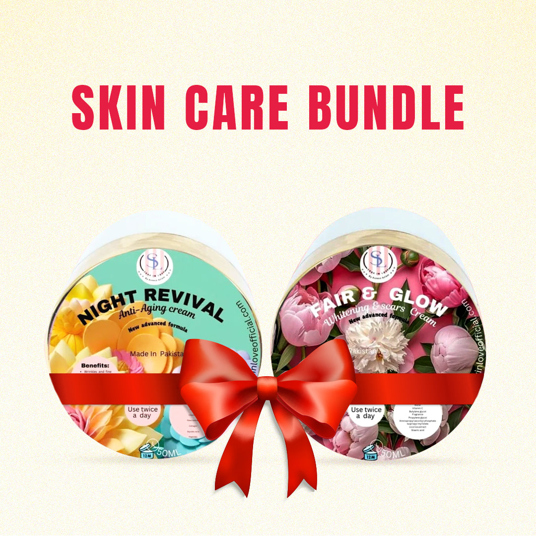 An image of the Night Revival + Fair & Glow skincare bundle from Soak in Love features two creams adorned with floral and orchid designs. Both products promise to brighten the skin and are elegantly tied together with a red ribbon against a light background, promoting a youthful complexion.